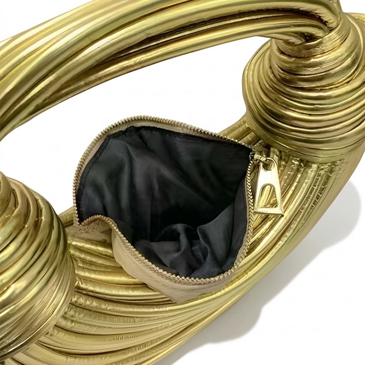 LE SAC À LA BOBINE DORÉE