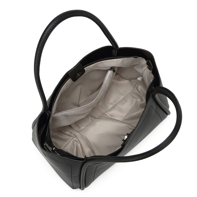 DIE STRUKTURIERTE LYCHEE-NARBENLEDER-TASCHE