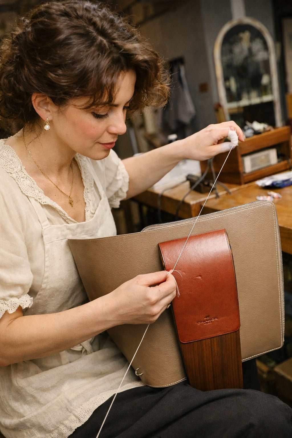 Hand stitching a structured leather bag
